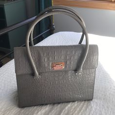 New Without Tags! Never Used Just Been Stored. Croc Embossed Handbag! Grey Very Well Kept And Clean Just A Few Tiny Marks From Being Stored (See Photos) Very Nice And Has A Lot Of Room. Can Be Worn As A Shoulder Bag Also: ) 13.5”Lx11”H Smoke Free Pet Free Home Formal Gray Top Handle Bag, Gray Tote Shoulder Bag With Detachable Strap, Gray Business Bags With Silver-tone Hardware, Gray Satchel Shoulder Bag For Formal Occasions, Luxury Gray Top Handle Satchel, Luxury Gray Shoulder Bag, Elegant Top Handle Laptop Bag, Formal Gray Satchel Shoulder Bag, Formal Gray Bag With Detachable Strap