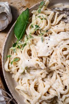 a plate full of pasta with garlic and herbs