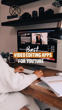 a person sitting at a desk in front of a computer with the words best video editing apps for youtube