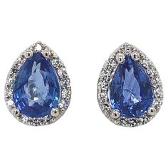 A pair of platinum pear shape stud earrings featuring blue sapphires. The sapphires are a beautiful medium blue color. The pair weighs 1.80 carat total. The sapphires measure about 6.8mm x 4.8mm. There are 28 tiny round diamonds weighing .13cts total and measuring about 1mm. They measure 3/8" long and the pair weighs 2.08dwt. These are new. Clear Sunglasses Frames, Fantasy Cars, Clear Sunglasses, Sapphire Stud Earrings, Blue Sapphire Studs, Aquamarine Studs, Ruby Earrings Studs, Vintage Stud Earrings, Sapphire Earrings Studs