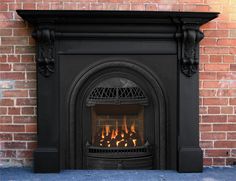 a black fireplace with flames burning in it