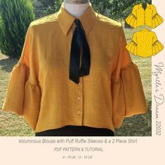 a yellow blouse with ruffle sleeves and a black tie