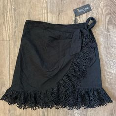 Nwt! From Boutique Isabelles Cabinet Eyelet Ruffle Wrap Mini Skirt. Lace Ruffle Bottoms For The Beach, Lace Ruffle Bottoms For Beach, Lace Ruffle Beach Bottoms, Beach Lace Bottoms With Ruffles, Lace Ruffled Beach Bottoms, Black Lace Mini Skirt For Summer, Chic Lace Skirt With Ruffle Hem, Summer Lace Skirt With Ruffle Hem, Black Lace Trim Mini Skirt For Summer