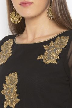 Black georgette peplum two layered short kurta with three quarter double layered bell sleeves embellished with gold embroidered motifs with gold gota patti on sleeves and hem edges Product Features:   Color: Black Fabric: Georgette Fit: Regular Sleeves: 3/4th Sleeves Neck: Round Neck Pattern: Embroidered Length: 31 Inch Product Weight: 500 Gram Occasion: Festive Disclaimer: There will be slight difference in digital to actual Image Gold Blouse With Resham Embroidery In Georgette, Gold Georgette Blouse, Gold Georgette Blouse With Dupatta, Gold Anarkali Georgette Blouse, Diwali Georgette Sets With Gold Embroidery, Gold Sharara With Straight Kurta For Party, Festive Gold Georgette Blouse, Party Kurta With Gold Embroidery For Diwali, Diwali Party Kurta With Gold Embroidery