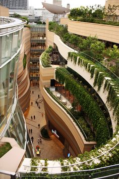 an aerial view of a building with plants growing on the walls