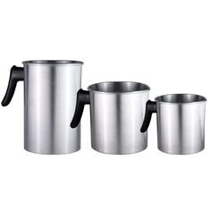 three stainless steel mugs with handles on each one and the other two are empty