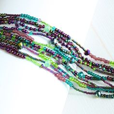 "Color Block" 10 Strand Peacock Colors Iridescent & Glass Beads Bracelet Purple, Green, Blue Dimensions: Approx. Length Of 7.5" X 1.25 " Wide. Easy To Open/Close Double Magnetic Clasp. Bracelet Is Handmade In Guatemala Using Artisan Crafted Czech Glass Beads. Each Bracelet Is Unique, No Two Are Ever Exactly The Same; Handmade Principles Of Fair Trade Are Upheld Visit Our Posh Closet See The Complete Collection Bracelets, Necklaces, Earrings Purple Multi-strand Beaded Bohemian Bracelets, Purple Faceted Beads Bracelets For Festivals, Purple Multi-strand Bohemian Beaded Bracelet, Purple Faceted Beads Bracelet For Festivals, Purple Faceted Beaded Bracelets For Festivals, Bohemian Multi-strand Purple Beaded Bracelets, Bohemian Purple Multi-strand Beaded Bracelets, Purple Beaded Jewelry For Mardi Gras, Czech Beads Jewelry