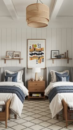 two twin beds in a bedroom with white walls