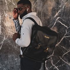 These Backpacks are custom, handmade and will take 21 days to make. This Roast by Bresheh executive backpack is carefully crafted to make you and your crew purposeful and prepared for life. It is made in Jamaica by seasoned Dreammakers from premium vegan leather and comfortably fits up to a 15' laptop. There are dedicated compartments for all your stationery items, files, folders, books, passports, business cards, keys, and water bottles. You will be happy to know that it can seamlessly attach t Leather Student Backpack, Leather Backpack For Students, Black Leather Student Backpack, Business Travel Backpack, Mens Backpack Travel, Name Initials, Stationery Items, 21 Days, Black Backpack