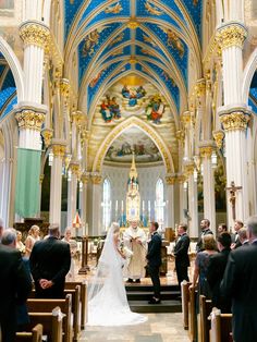 the bride and groom are getting married at the alter