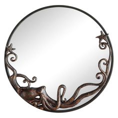 an oval mirror with an octopus on the bottom and starfishs in the middle