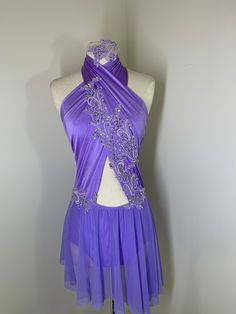 a mannequin with a purple dress on it