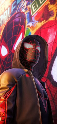 a spider man standing in front of a graffiti covered wall