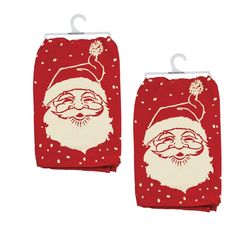 two towels with santa claus on them, one is red and the other is white