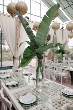 a table set up with plates and place settings