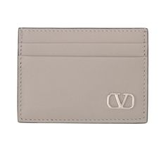 Valentino Garavani's Logo, The Vlogo Signature, Takes Canter Stage In This Leather Cardholder. In Polished Silver-Tone Hardware, Its Metallic Sheen Contrasts With The Smooth Grey Background It Is Set Against, Adding An Instantly Recognizable Touch To The Accessory. Grained Calfskin Card Holder In Gray. Burnished Edges In Black Throughout. Silver-Tone Logo Hardware At Face Four Card Slots Central Note Slot H3 X W4 In Color: Grigio/Perla Calfskin. Made In Italy. Elegant Rectangular Logo Card Holder, Leather Cardholder, Grey Background, Key Card Holder, Card Holder Leather, Gray Background, Valentino Garavani, Card Slots, Calf Skin