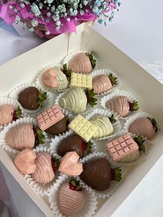 chocolate covered strawberries and marshmallows in a box