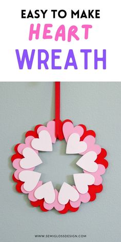 paper heart wreath hanging on the wall with text overlay that reads easy to make heart wreath