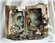 an open book with pictures and plants inside