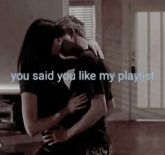 a man and woman kissing in front of a tv screen with the words you said you like my playlist