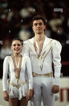 an olympic figure and his partner posing for the camera - stock image