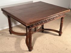 an old wooden table sitting on the floor