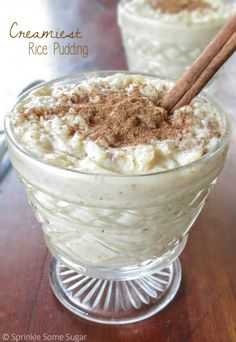 two desserts with cinnamon sticks in them on a table