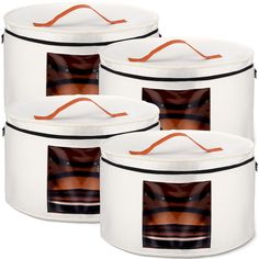 three white round storage containers with orange trimmings on the top and bottom, set of 3