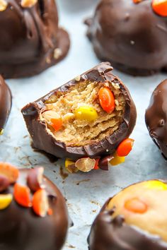 chocolate covered candy candies with candy corn on top