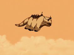 an animal is flying through the air with clouds in the backgrouds and orange sky behind it