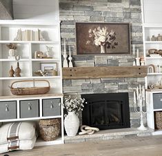 a living room filled with lots of furniture and a fire place in front of a stone fireplace