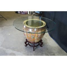 a glass table with a vase on it