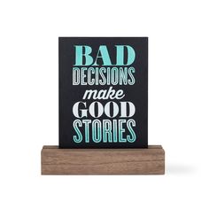 a wooden block with the words bad decision make good stories on it