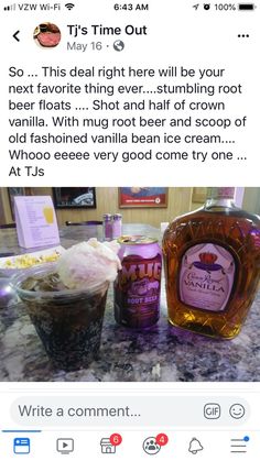 a bottle of booze next to a cup of ice cream on a counter top