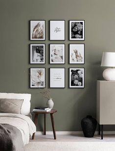 a bedroom with green walls and pictures on the wall, including a white bed in between two nightstands