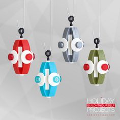 three different colored objects hanging from strings on a gray background with the words holiday build - yourself projects written below them