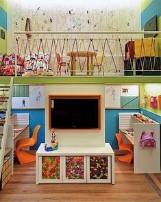 a child's playroom with colorful furniture and toys on the shelves, including a television