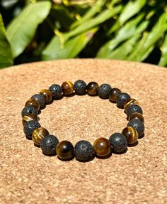 HOW FAST IS SHIPPING? -Make your purchase today and choose one of three shipping options. We usually process orders in one day for even faster shipping Essential Oil: Lava bead bracelets can be used with essential oils. Just add a drop or two to the lava stone. *Protection: The Tiger's Eye is often considered a protective stone. It is believed to create a shield against negative energies and psychic attacks. Some people carry or wear Tiger's Eye as a talisman for protection. Grounding and Balance **Courage and Confidence Prosperity and Abundance: Tiger's Eye is sometimes associated with attracting wealth and good fortune. It is believed to enhance one's ability to manifest goals and achieve success. = Lava Stone is a powerful crystal, that can bring to the wearer strength, courage, groundi Hand-strung Lava Stone Bracelets, Brown Spacer Beads Jewelry For Meditation, Healing Lava Stone Beaded Bracelets, Spiritual Lava Stone Bracelets With 8mm Beads, Hand-strung Lava Stone Bracelets With Round Beads, Adjustable Hand-strung Lava Stone Jewelry, Adjustable Hand-strung Lava Stone Bracelet, Spiritual Beaded Bracelet Wristband, Lava Stone Bracelets With 8mm Beads