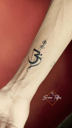 a person's arm with a tattoo on it and the word faith written in cursive writing