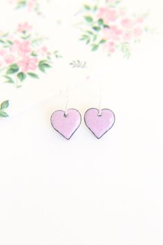 These beautiful pink heart earrings handmade with enamel on copper would make a lovely girl friend gift this Galentines day. The baby pink earrings measure approximately 13mm in diameter and are fired using pastel pink enamel which creates a subtle glazed finish. The copper earrings are backed with counter enamel to insure comfort and strength. They come complete with 925 Sterling silver earring wires. All jewellery comes packed in a quality iamrachel box, just add a bow and they're ready for gi Pink Heart Earrings For Everyday, Small Pink Earrings For Gifts, Pink Heart Charm Earrings As Gift, Pink Hand Painted Earrings For Gift, Pink Heart Earrings With Heart Charm As Gift, Hand Painted Pink Earrings For Gift, Hand Painted Pink Earrings For Gifts, Pink Heart Charm Earrings For Gift, Pink Enamel Earrings For Gift