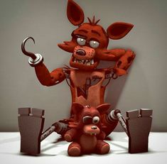 a red cartoon character sitting on top of a table