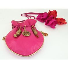 Late 1980's drawstring leather handbag by French jewelry designer, Dominique Aurientis, embellished with gold plated charms and medallions.  This fabulous handbag is a testament to 1980's maximalist style with a combination of a functional silhouette and opulent decoration.  The buttery soft leather is hot pink trimmed in bright gold.  The drawstring rope handle is fed through gold rings that are decorated with a variety of filigree orbs and charms accented by rhinestones and glass beads.  The r Luxury Celebration Potli Bag, Luxury Gold Potli Bag For Celebration, Luxury Gold Potli Bag For Festivals, Vintage Gold Bag For Festivals, Vintage Gold Bags For Festivals, Chic Pink Bags With Gold-tone Hardware, Pink Bucket Bag With Gold-tone Hardware For Travel, High-end Pink Bags With Gold-tone Hardware, Pink Bucket Bag With Gold-tone Hardware