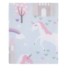 a unicorn blanket with trees and buildings in the background on a light blue groundcloth