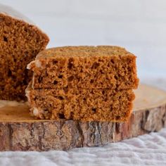 a piece of cake sitting on top of a wooden cutting board