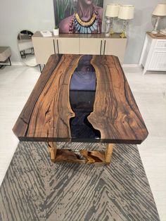 a wooden table sitting on top of a carpeted floor