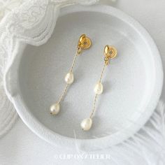 * Style: Minimalist, Classy, Elegant * Material: Gold-plated brass, Freshwater Pearls (natural pearl, each is unique) * Dimension:  Approximate overall length: 5.5 cm ( 2.17 inch)  * Please note that the size and shape of the pearls vary from pair to pair. *  * ❀ *  * ♥ ♥ How to wear coil pad clip-on earrings?  All you have to do is slip the clip-on onto your earlobe, press the coil pad and it will stay. ❗️❗️For wearing tips, please go to the "About" section, we've filmed a video for how to wear Gold Minimalist Drop Pearl Earrings, Minimalist Drop Earrings For Wedding, Gold Minimalist Teardrop Bridal Earrings, Elegant Gold Earrings With Simple Design, Elegant Simple Design Gold Earrings, Minimalist Gold Bridal Earrings, Minimalist Bridal Dangle Earrings For Anniversary, Elegant Simple Gold Earrings, Metal Pearl Earrings With Plating For Wedding