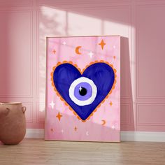 an eyeball in the shape of a heart on a pink wall next to a vase