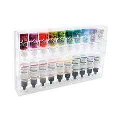 an assortment of acrylic paint colors in a display case on a white background