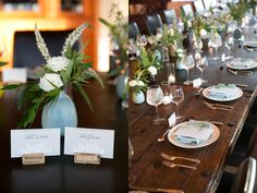 the table is set with place cards, silverware and flowers in vases on it