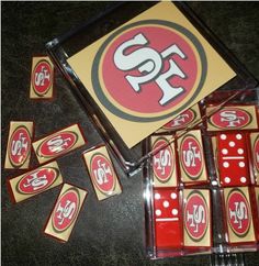 several red and yellow dices sitting next to each other on the floor with san francisco logo